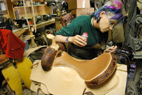 Wendy Allen making a saddle.