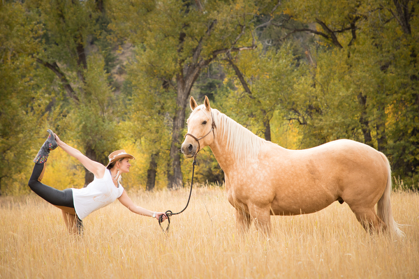 woman in dancer pose with palomino 