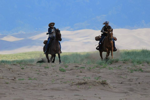 Zapata Ranch Galloping on Sand Dunes