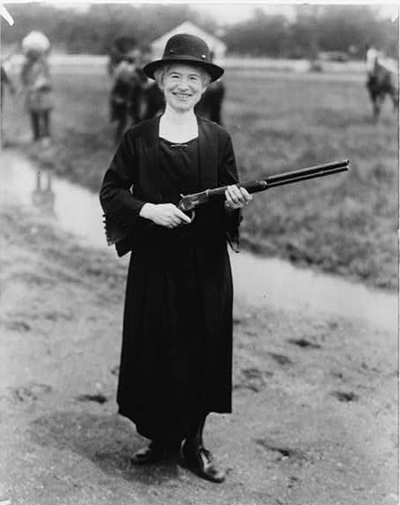 Annie Oakley, with gun Buffalo Bill gave her / staff photo.