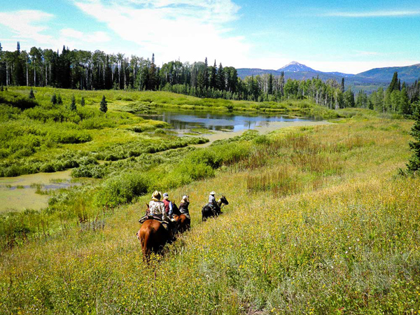 group trail ride on horseback at vista verde guest ranch colorado