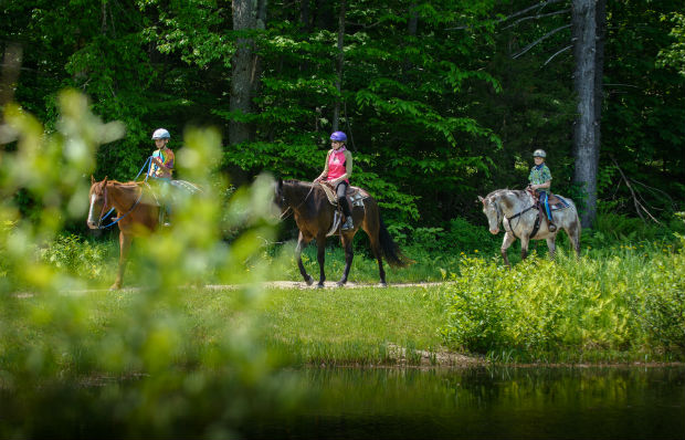 Kids riding along the lake at Mountain Top Resort