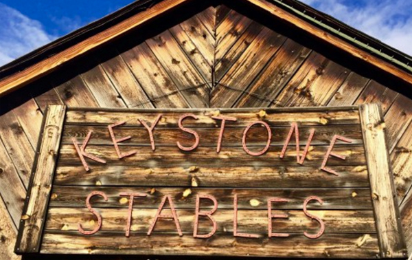 The Keystone Stables sign where visitors can ride horseback in Colorado