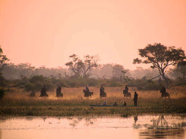 equestrians at sunset okavango delta horse safari