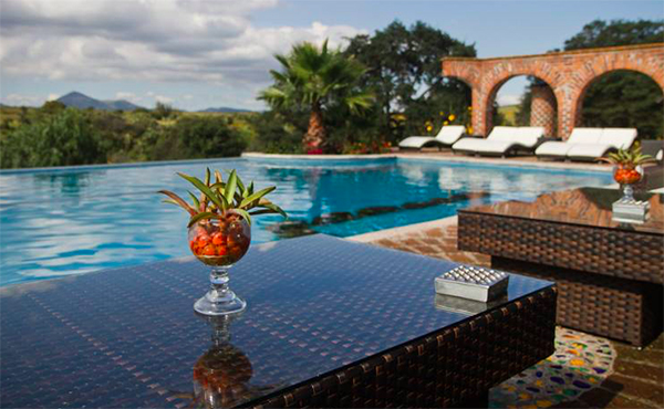 drinks by the pool at rancho las cascadas in mexico