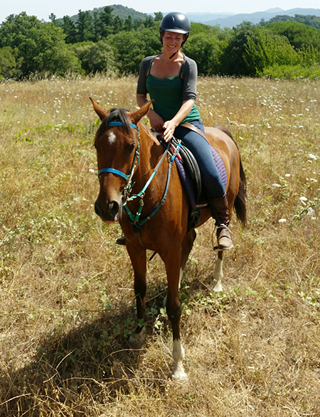 woman riding spanish horse in catalonia spain