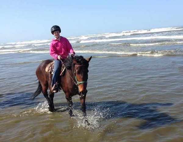 horse and rider in pacific ocean long beach washington