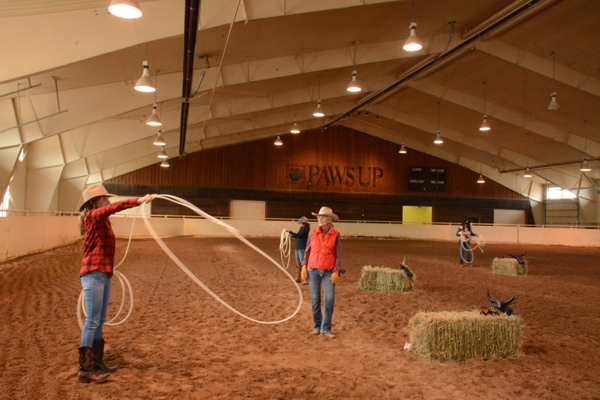 woman in roping lesson at the resort at paws up montana