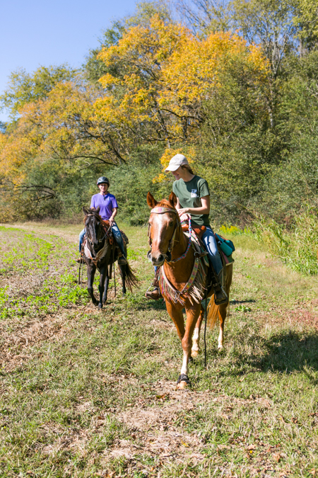 women ride horses at shel clair farms