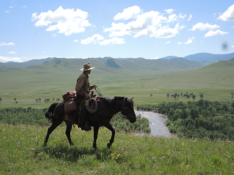 Keith taking a high route above the flooded plains of the Tuul river in Gorkhi Terelj National Park