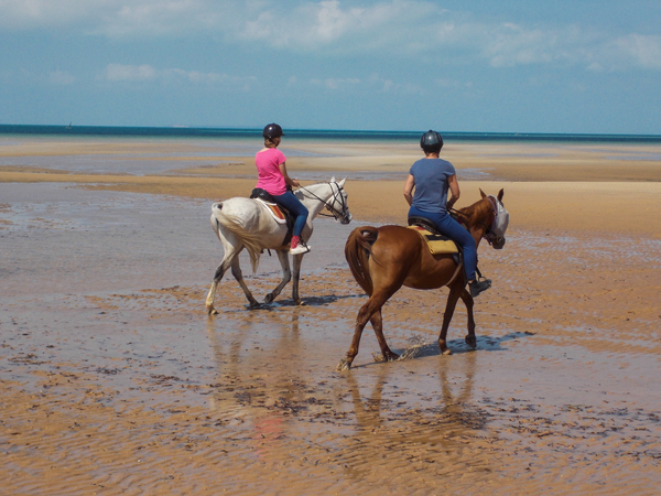 women horseback riding on the beach mozambique horse safari